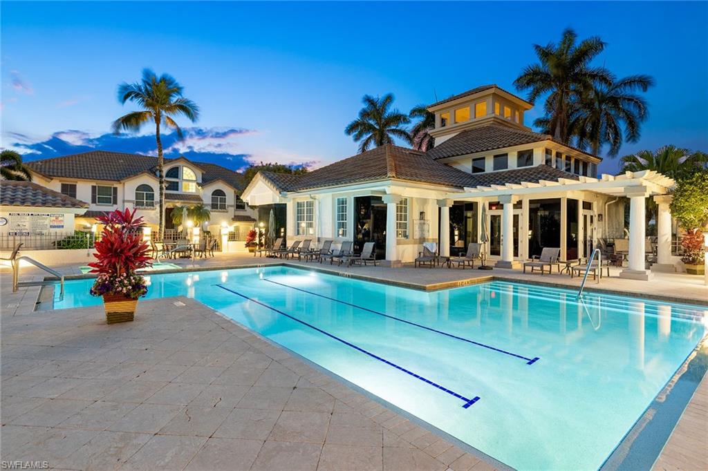 129 Colonade Circle, Unit 402 Naples, FL 34103 - Photo 32 of 36 a view of a building with a patio