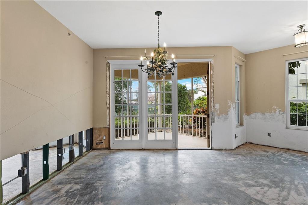 129 Colonade Circle, Unit 402 Naples, FL 34103 - Photo 9 of 36 a view of a livingroom with a porch