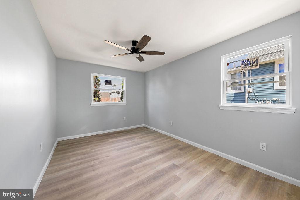 408 West 3rd Avenue Runnemede, NJ 08078 - Photo 11 of 29 a view of a big room with wooden floor and windows
