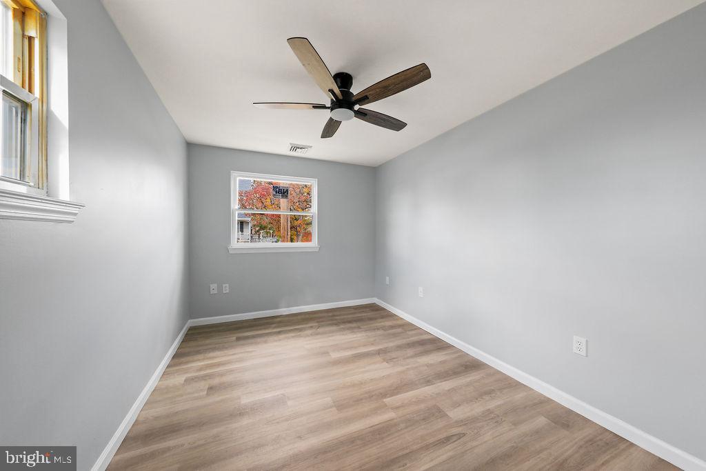408 West 3rd Avenue Runnemede, NJ 08078 - Photo 13 of 29 wooden floor in an empty room with a window