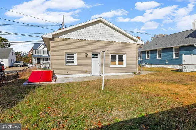 a view of a house with a yard and a garage