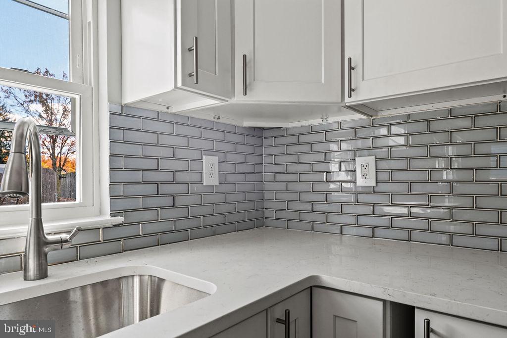 408 West 3rd Avenue Runnemede, NJ 08078 - Photo 4 of 29 a bathroom with a sink and a mirror