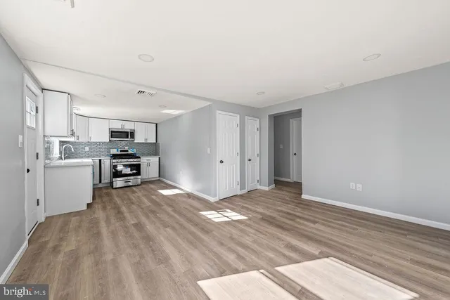 a view of a kitchen with furniture and a kitchen