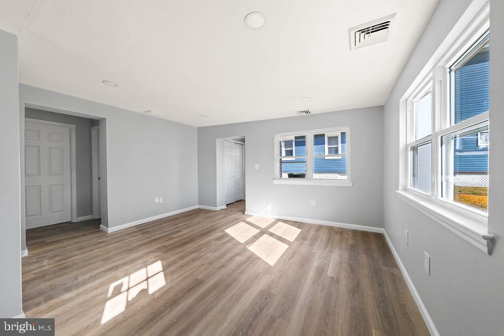 408 West 3rd Avenue Runnemede, NJ 08078 - Photo 9 of 29 a view of an empty room with wooden floor and a window