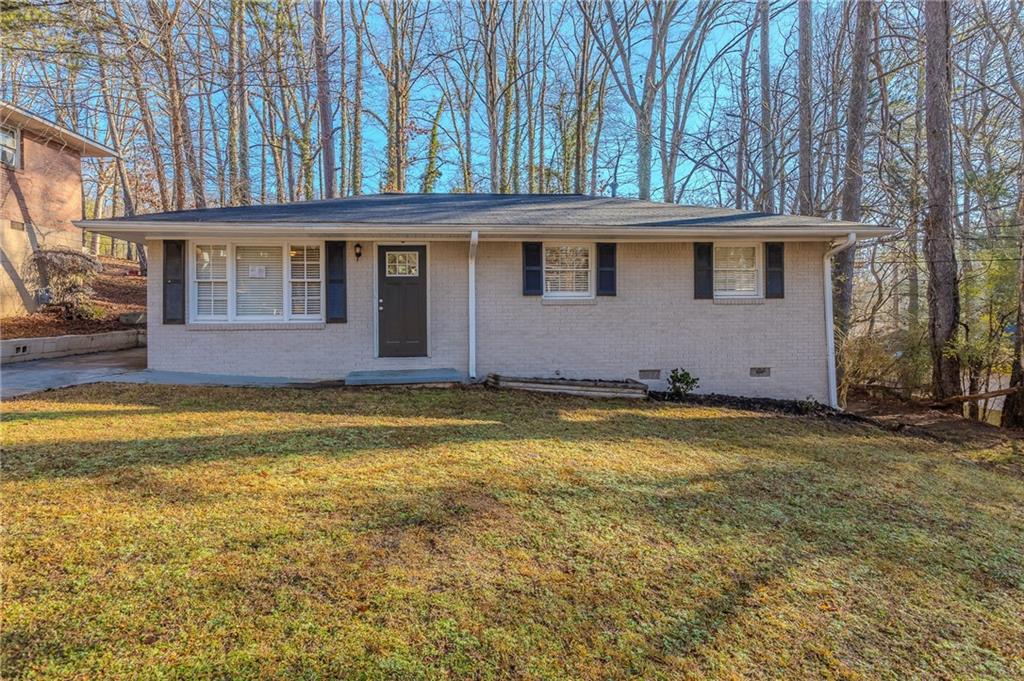404 Utoy Circle Southwest Atlanta, GA 30331 - Photo 1 of 1 a front view of a house with a yard