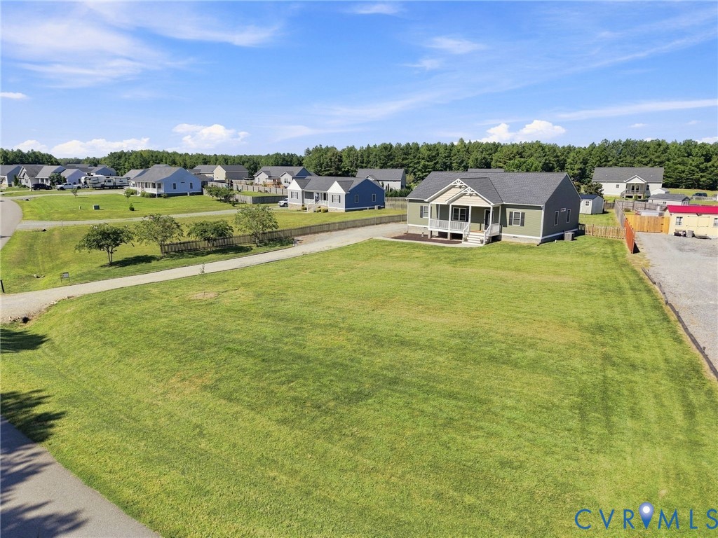 8718 Rock Cedar Road New Kent, VA 23124 - Photo 5 of 43 Expansive green space with a gravel pathway, surro