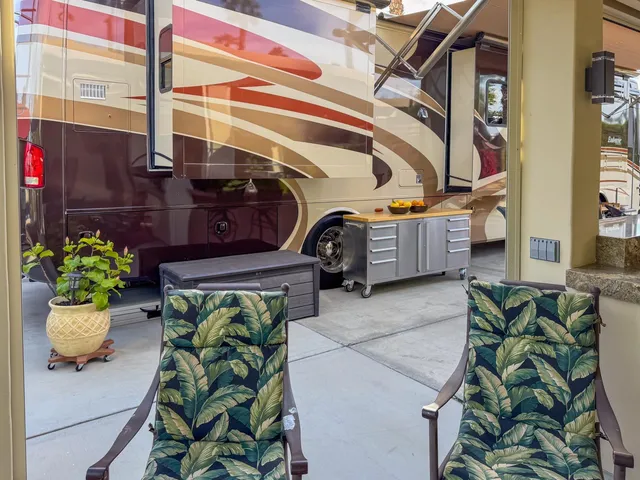 a view of backyard with swimming pool and furniture