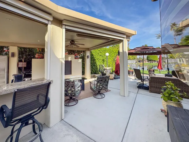 a view of a chairs and table in the patio