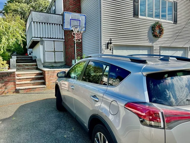 a view of a house with a bed and chair