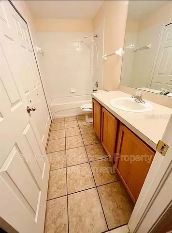a bathroom with a sink a mirror and a bathtub