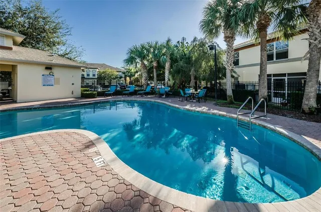 a view of a swimming pool with a patio