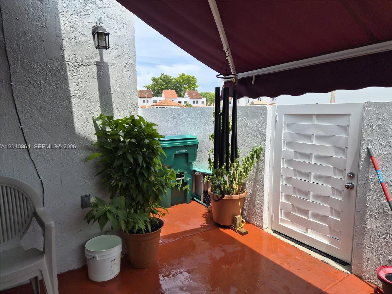 6201 Southwest 138th Court Miami, FL 33183 - Photo 6 of 7 a view of a porch with potted plants