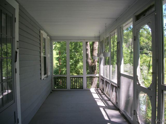 838 Pheasant Run Road Effort, PA 18330 - Photo 19 of 23 a view of a porch with wooden floor and outdoor space