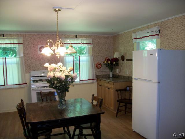 838 Pheasant Run Road Effort, PA 18330 - Photo 9 of 23 a dining room with furniture and chandelier