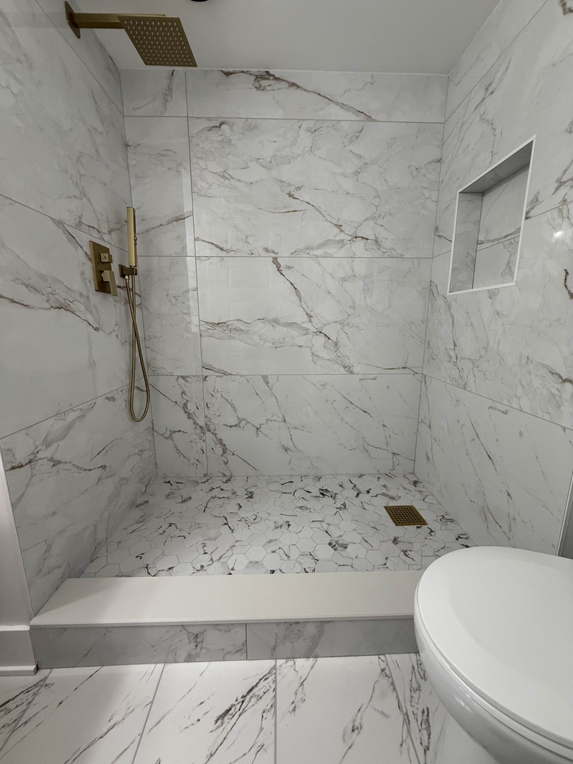 6230 West 63rd Place Chicago, IL 60638 - Photo 12 of 17 a bathroom with a toilet and shower