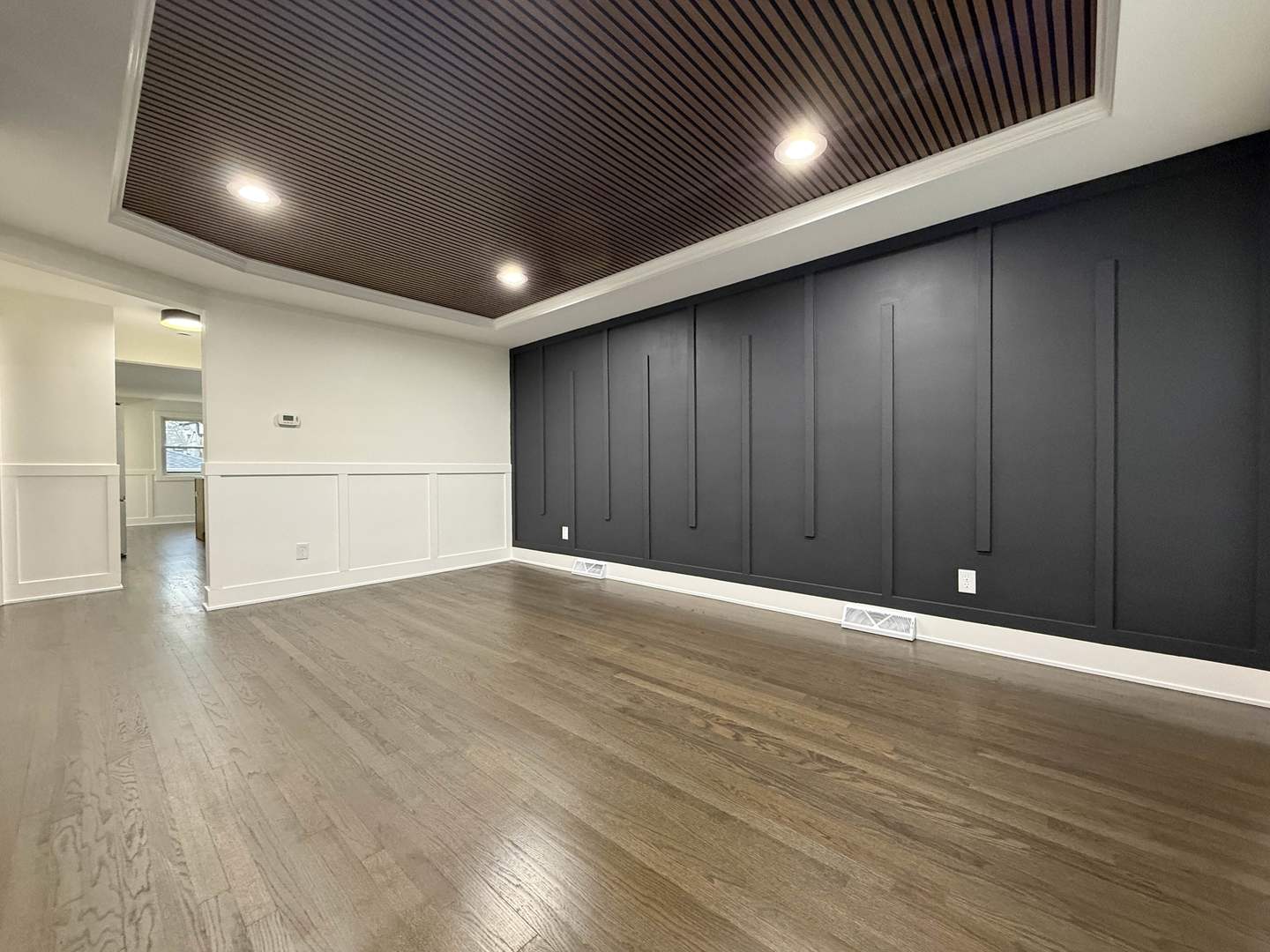 6230 West 63rd Place Chicago, IL 60638 - Photo 3 of 17 an empty room with wooden floor and windows