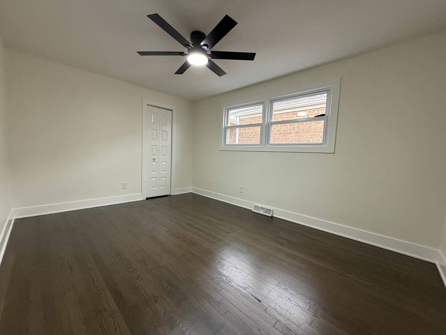 6230 West 63rd Place Chicago, IL 60638 - Photo 8 of 17 a view of a big room with wooden floor and windows