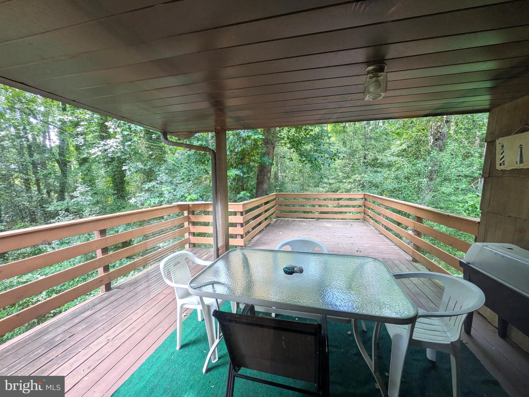 9683 Tharp Road Seaford, DE 19973 - Photo 17 of 41 Covered deck off den.