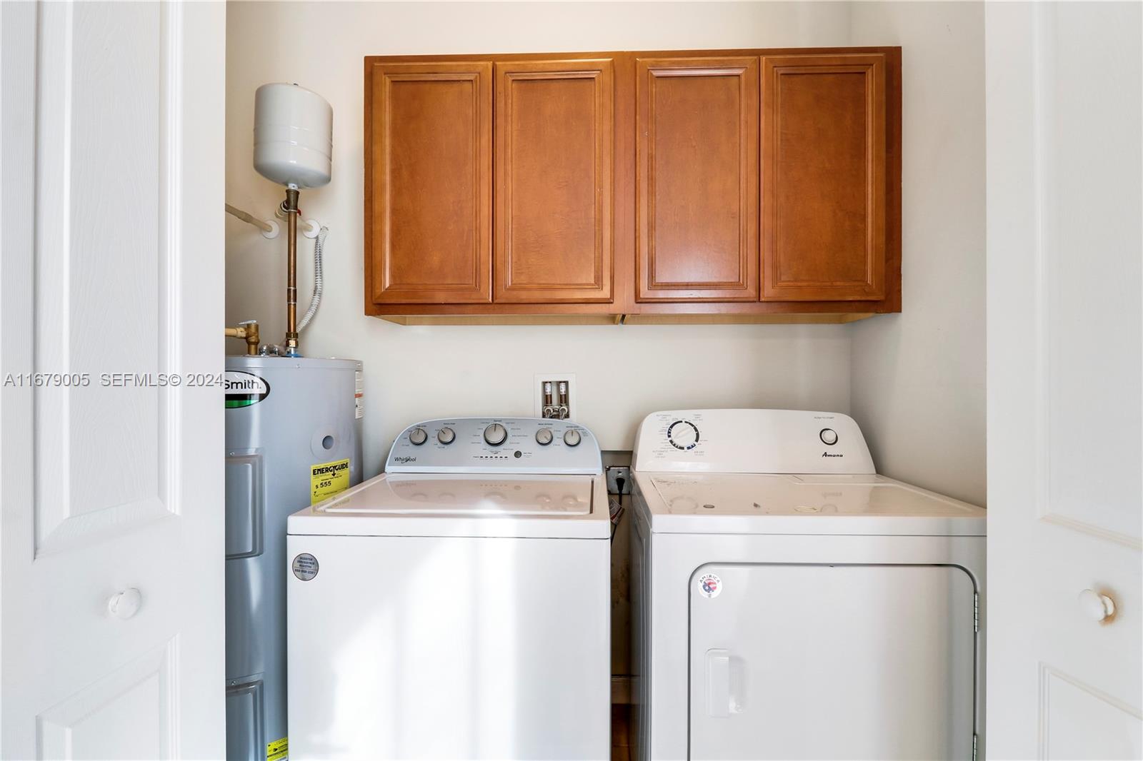 1184 Islamorada Drive, Unit 1184 Jupiter, FL 33458 - Photo 17 of 34 a utility room with dryer and washer