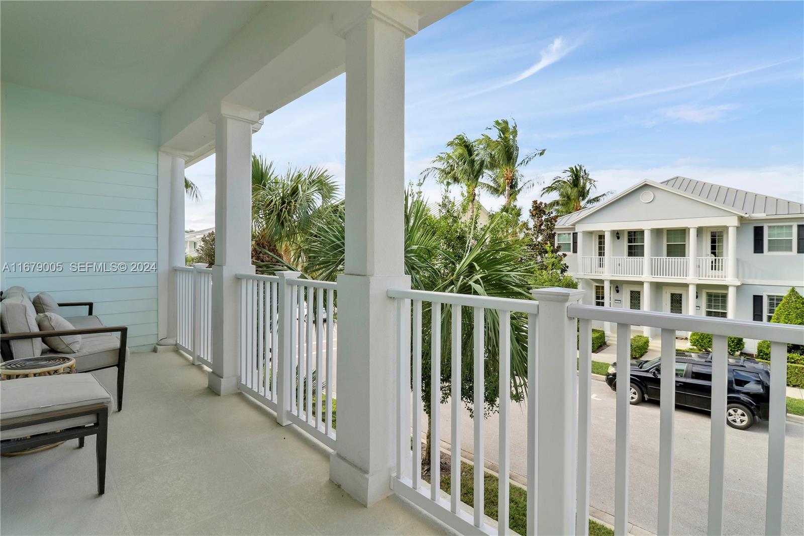 1184 Islamorada Drive, Unit 1184 Jupiter, FL 33458 - Photo 20 of 34 a view of a house with wooden floor and a fence