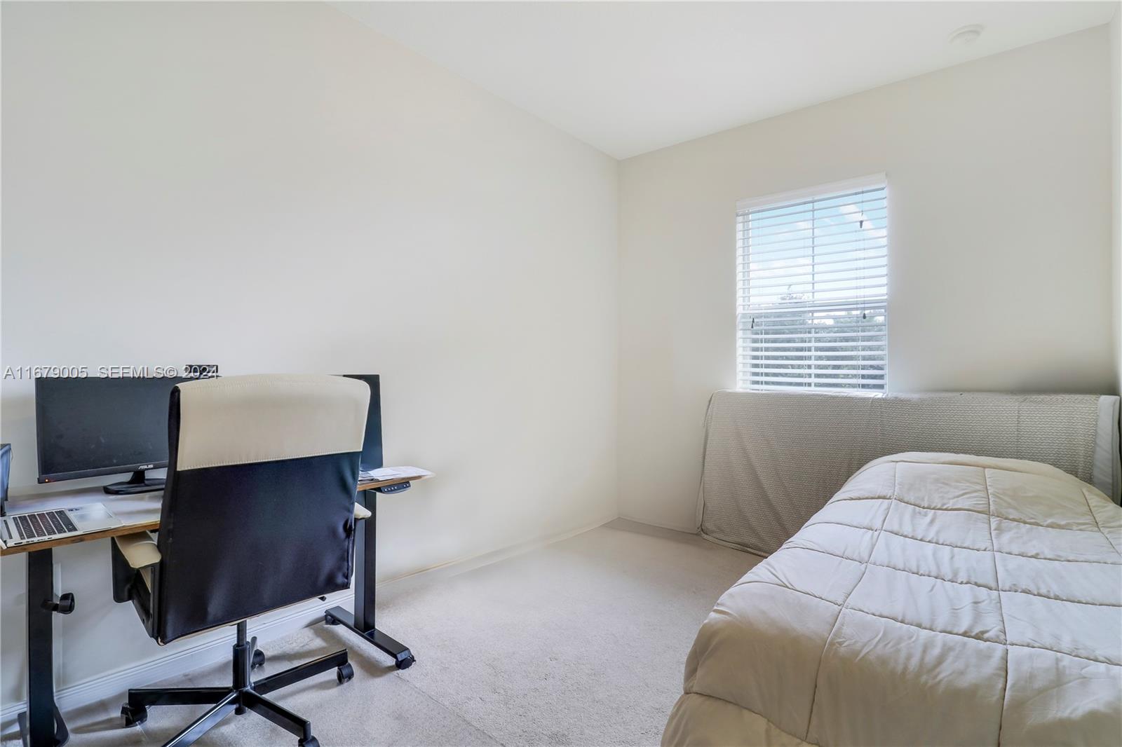 1184 Islamorada Drive, Unit 1184 Jupiter, FL 33458 - Photo 23 of 34 a bedroom with a workspace