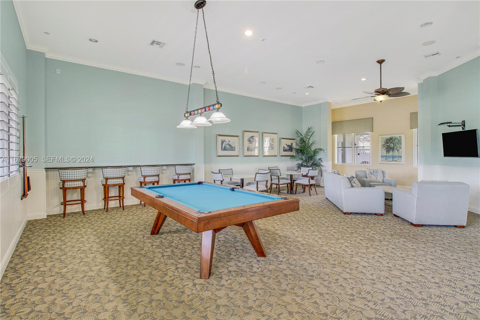 1184 Islamorada Drive, Unit 1184 Jupiter, FL 33458 - Photo 30 of 34 a living room with furniture a table and kitchen view