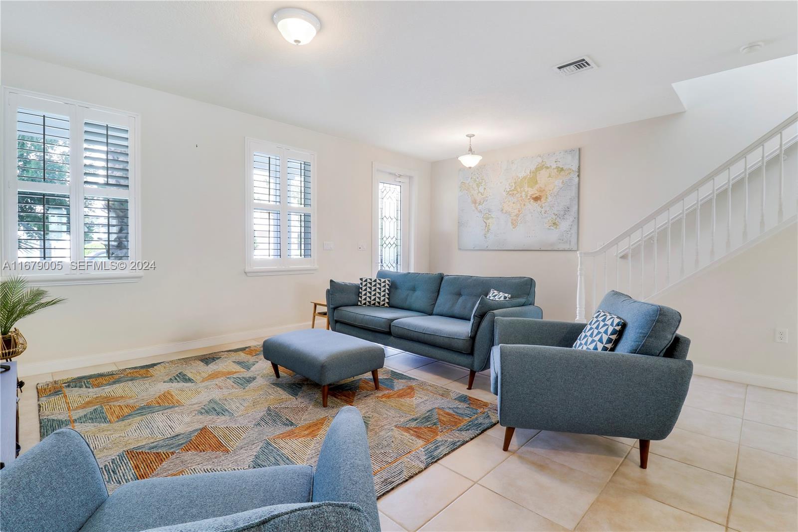1184 Islamorada Drive, Unit 1184 Jupiter, FL 33458 - Photo 3 of 34 a living room with furniture and a window