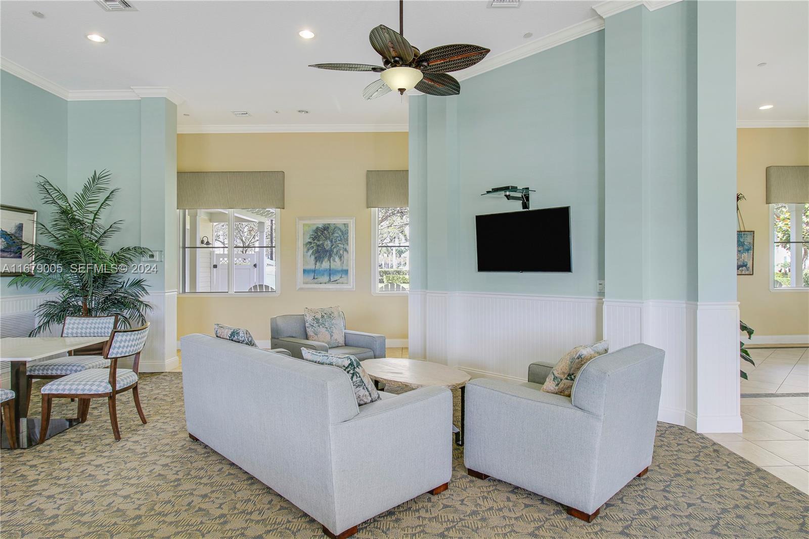 1184 Islamorada Drive, Unit 1184 Jupiter, FL 33458 - Photo 33 of 34 a living room with furniture and a flat screen tv