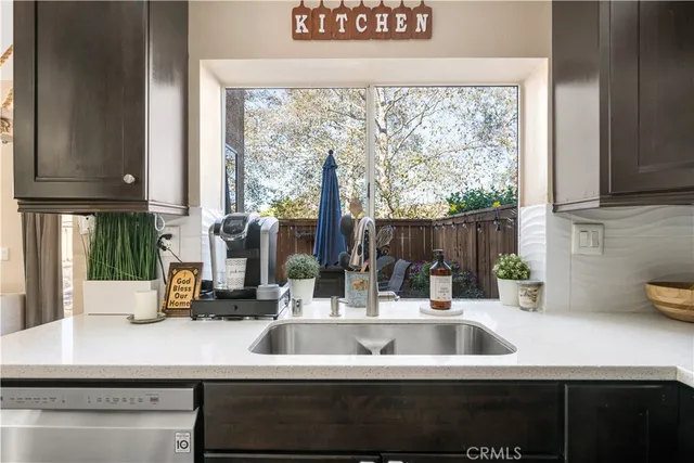 a kitchen with a sink and a window