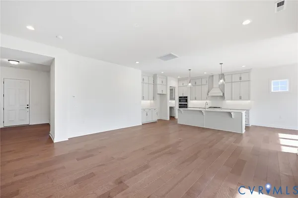 a view of kitchen with wooden floor