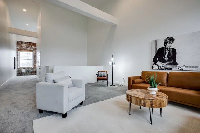 a living room with furniture and white walls