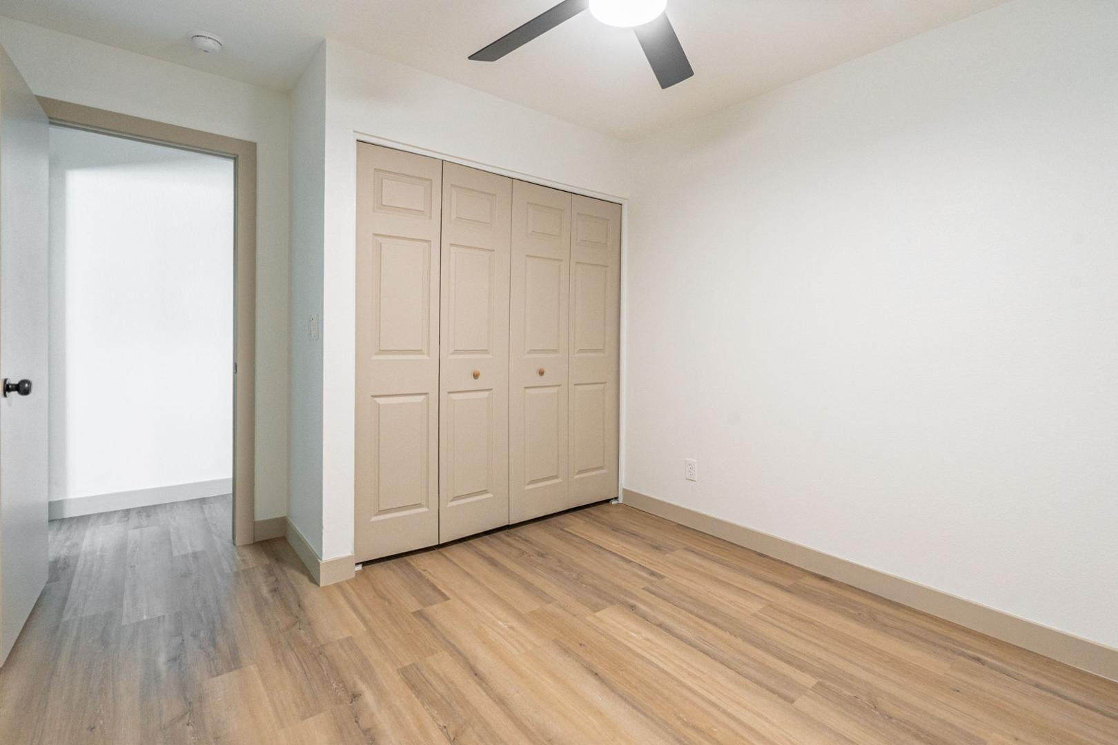 5739 West Monte Vista Road Phoenix, AZ 85035 - Photo 14 of 23 an empty room with closet and a ceiling fan