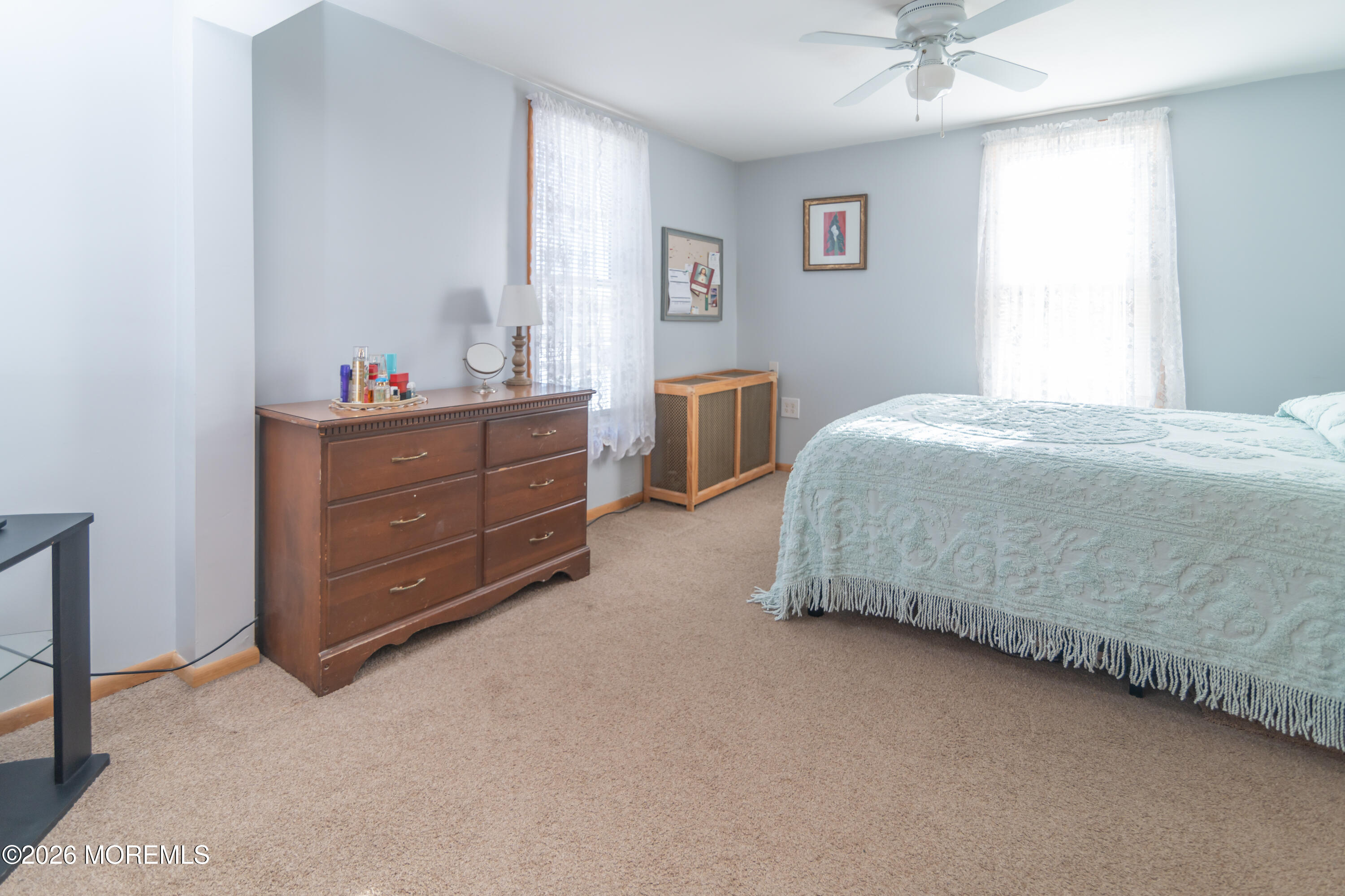 55 Lower Main Street Aberdeen, NJ 07747 - Photo 17 of 28 a bedroom with a bed and a mirror