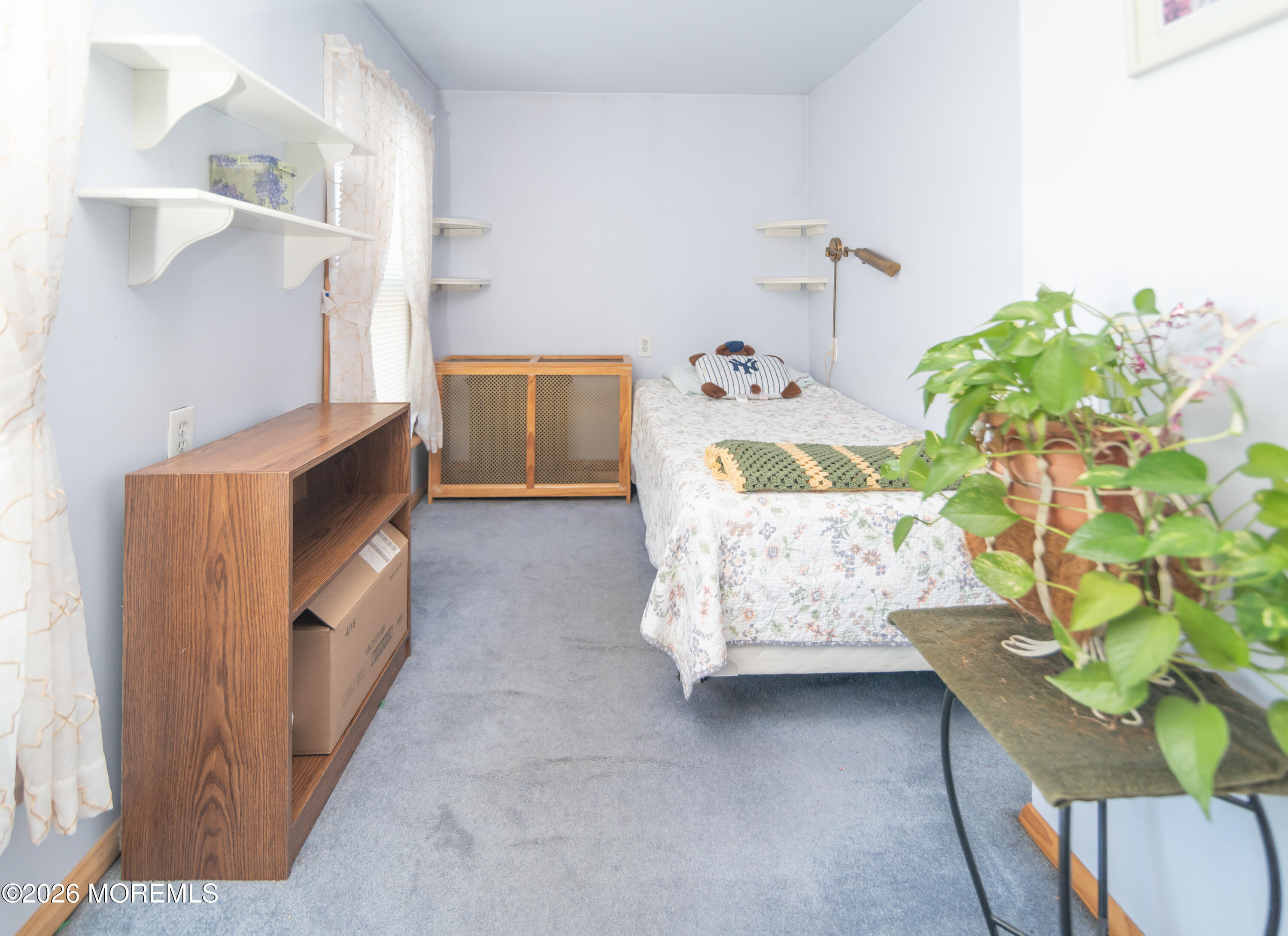 55 Lower Main Street Aberdeen, NJ 07747 - Photo 19 of 28 a bedroom with a bed and a dresser