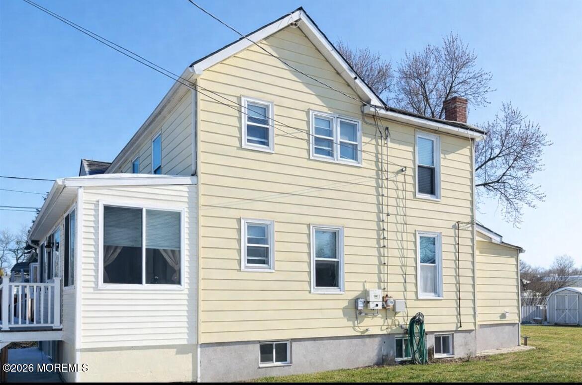 55 Lower Main Street Aberdeen, NJ 07747 - Photo 2 of 28 a view of a house with a yard and sitting area