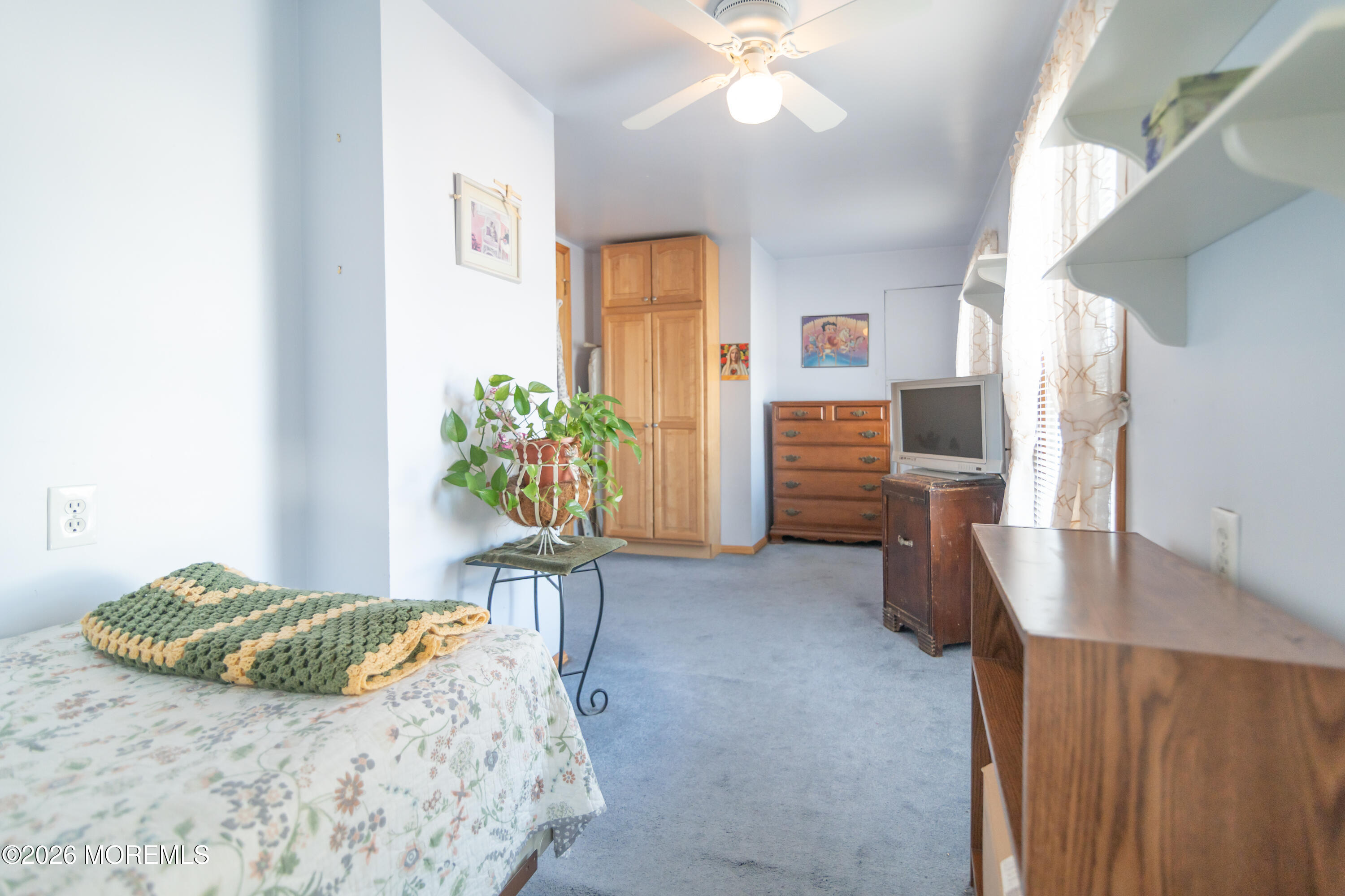 55 Lower Main Street Aberdeen, NJ 07747 - Photo 21 of 28 a bedroom with furniture and a bed