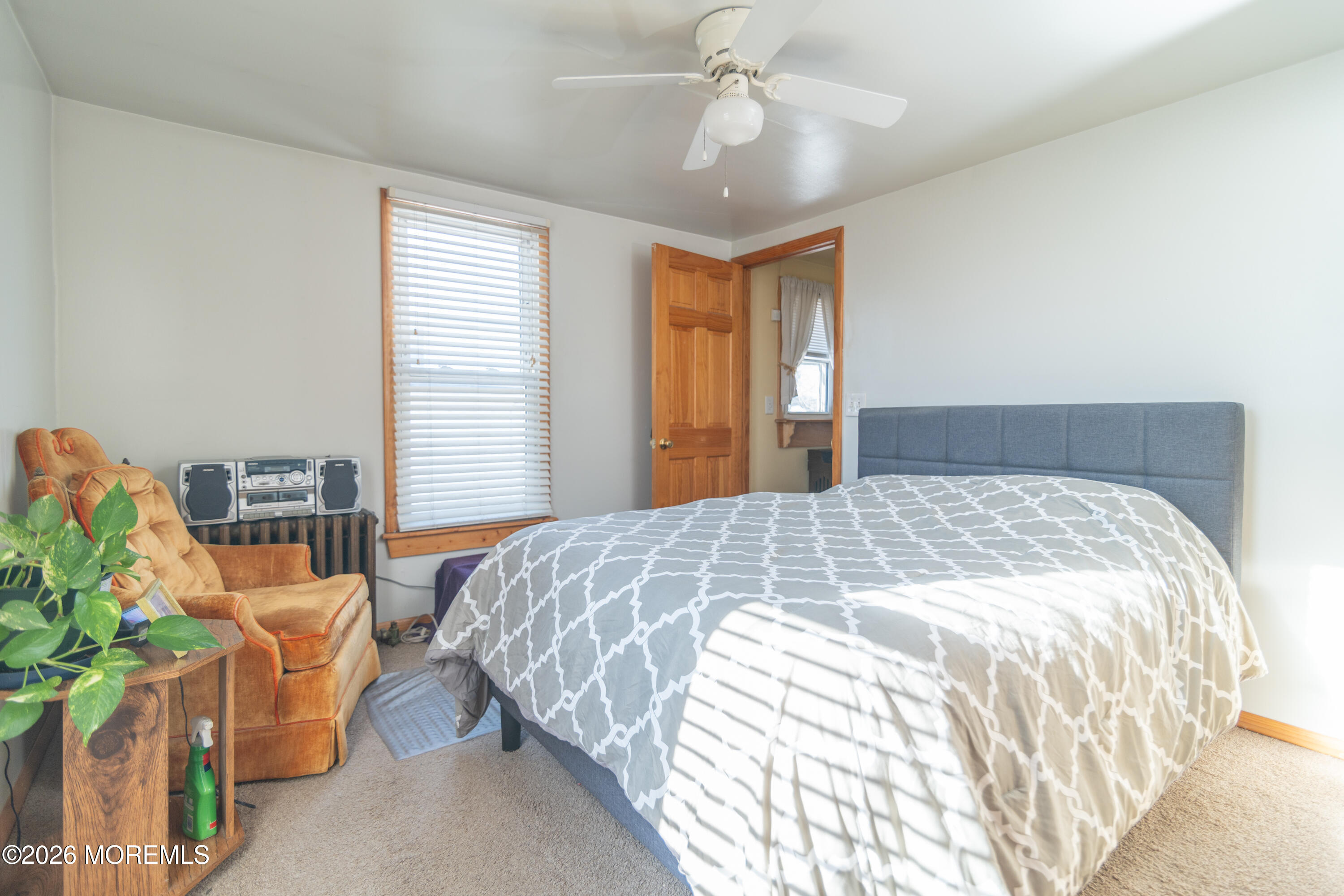 55 Lower Main Street Aberdeen, NJ 07747 - Photo 22 of 28 a bedroom with a bed and ceiling fan