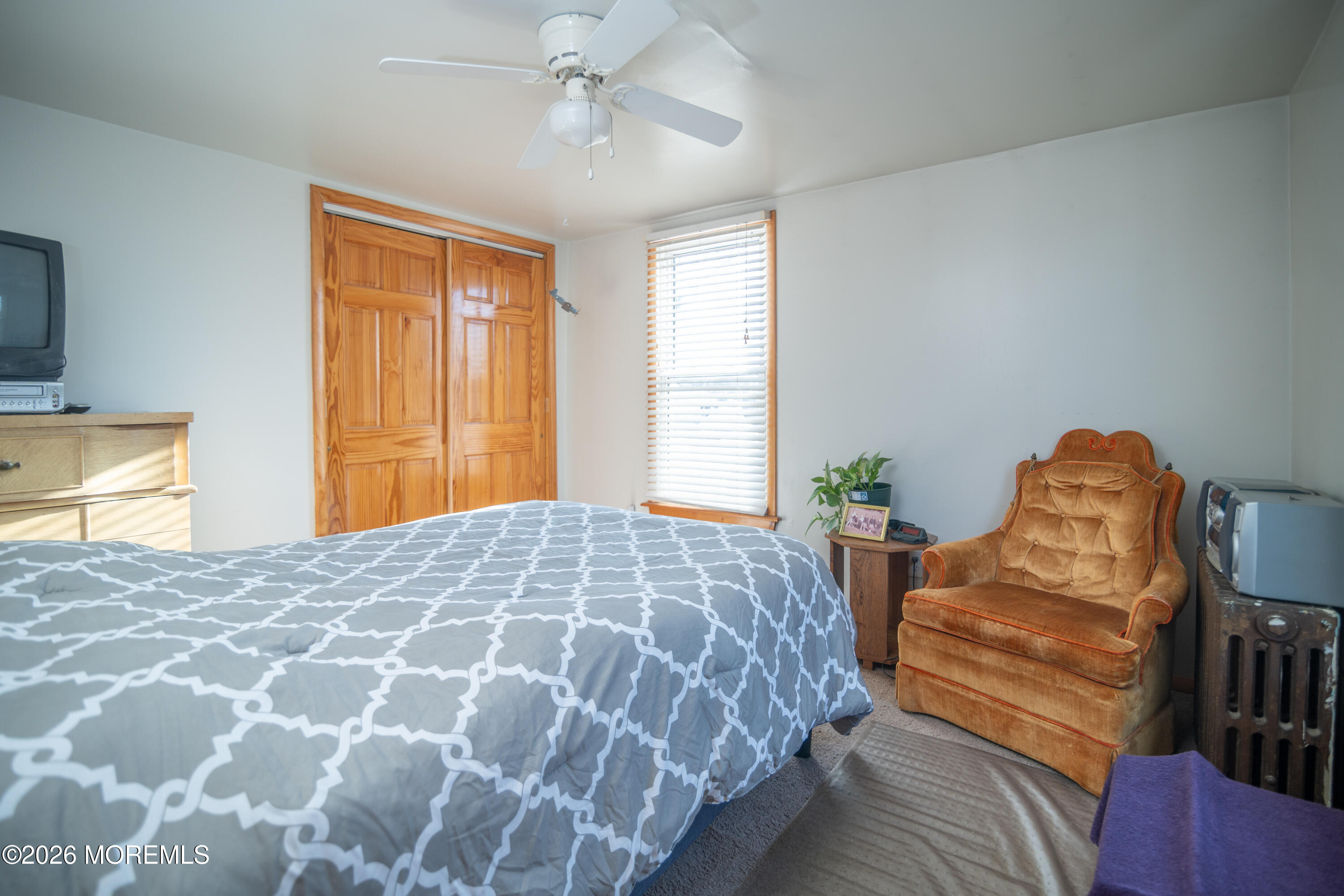 55 Lower Main Street Aberdeen, NJ 07747 - Photo 23 of 28 a bedroom with a bed and wooden floor