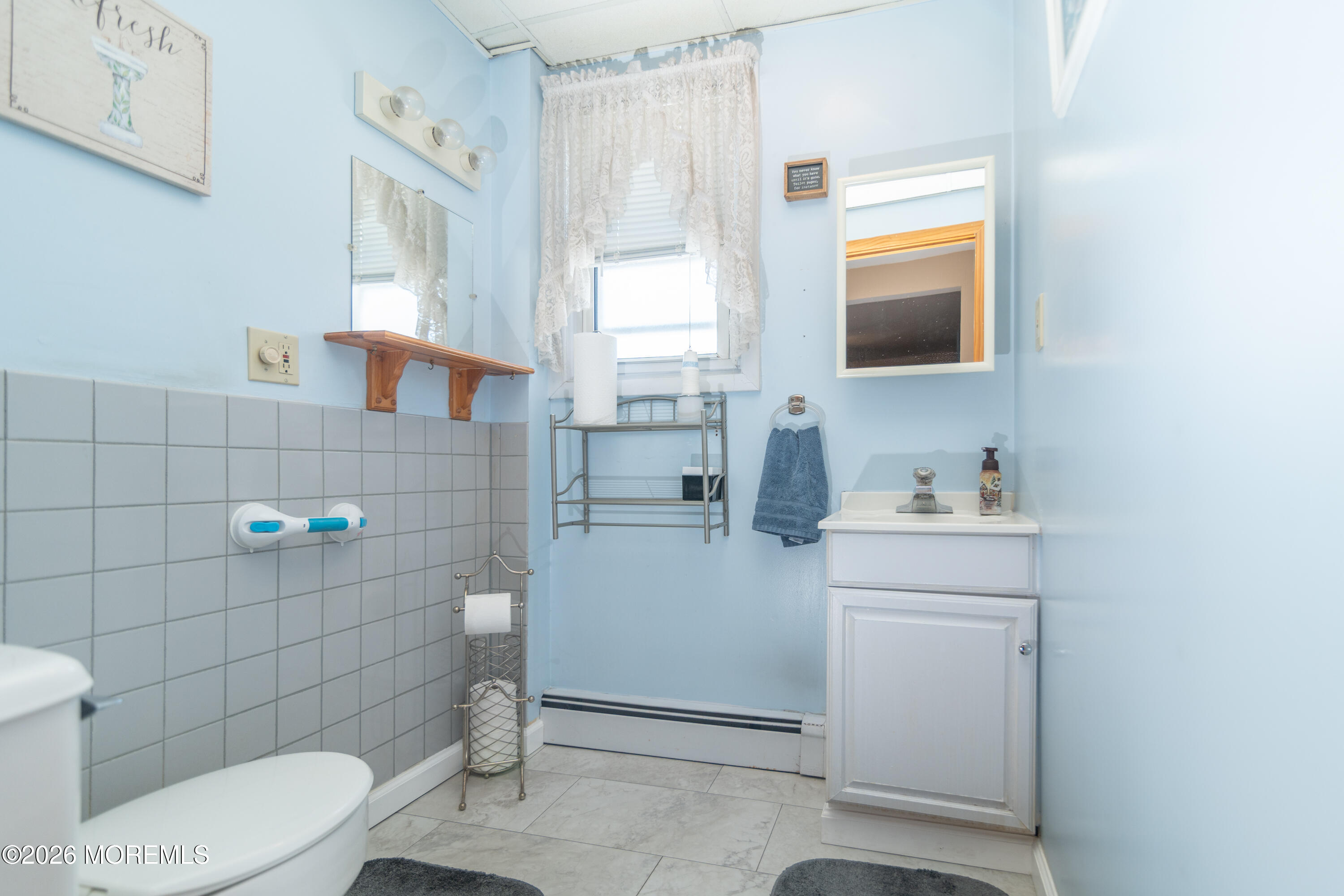 55 Lower Main Street Aberdeen, NJ 07747 - Photo 25 of 28 a bathroom with a toilet sink and mirror