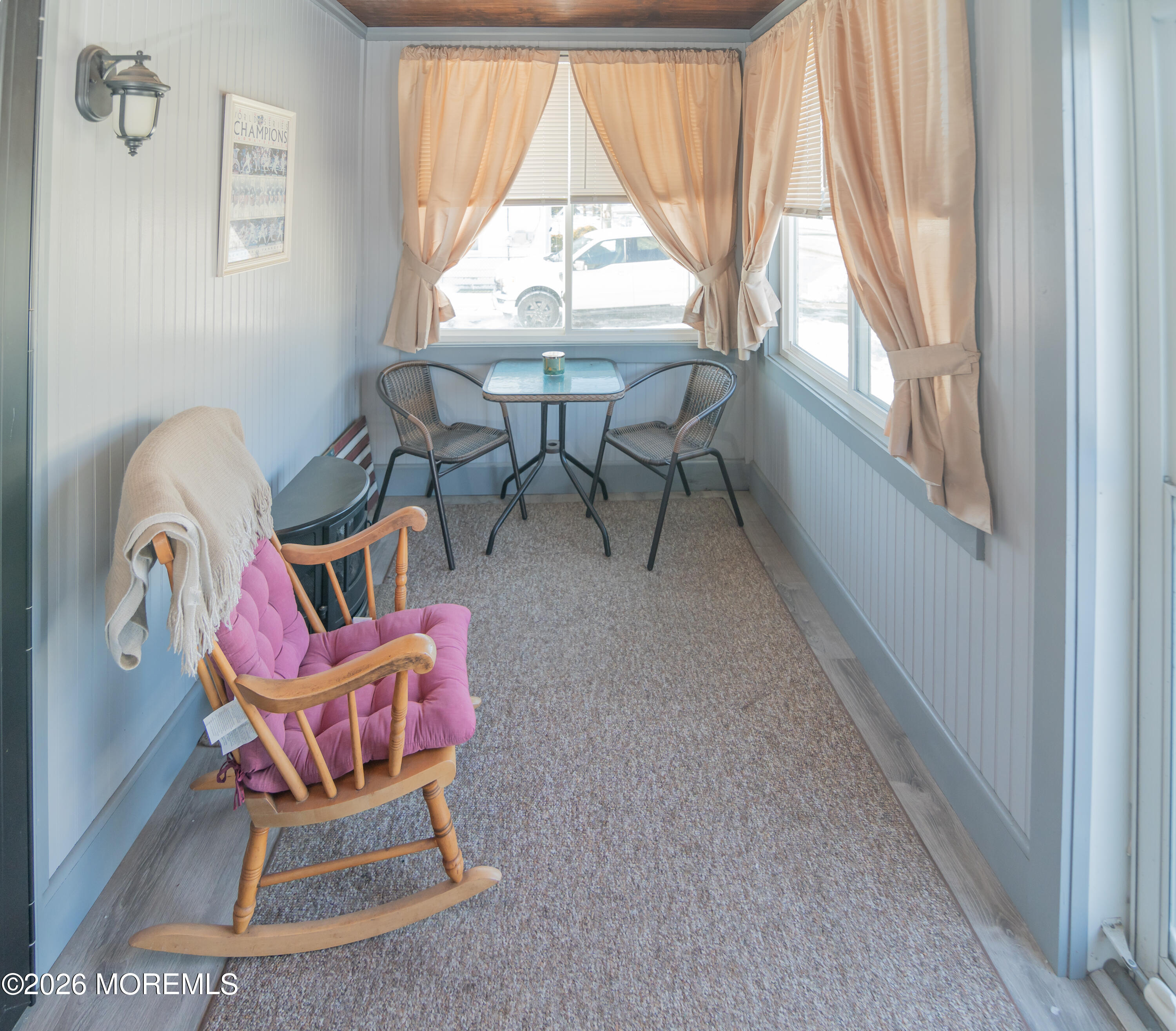 55 Lower Main Street Aberdeen, NJ 07747 - Photo 5 of 28 a living room with chairs and a floor to ceiling window