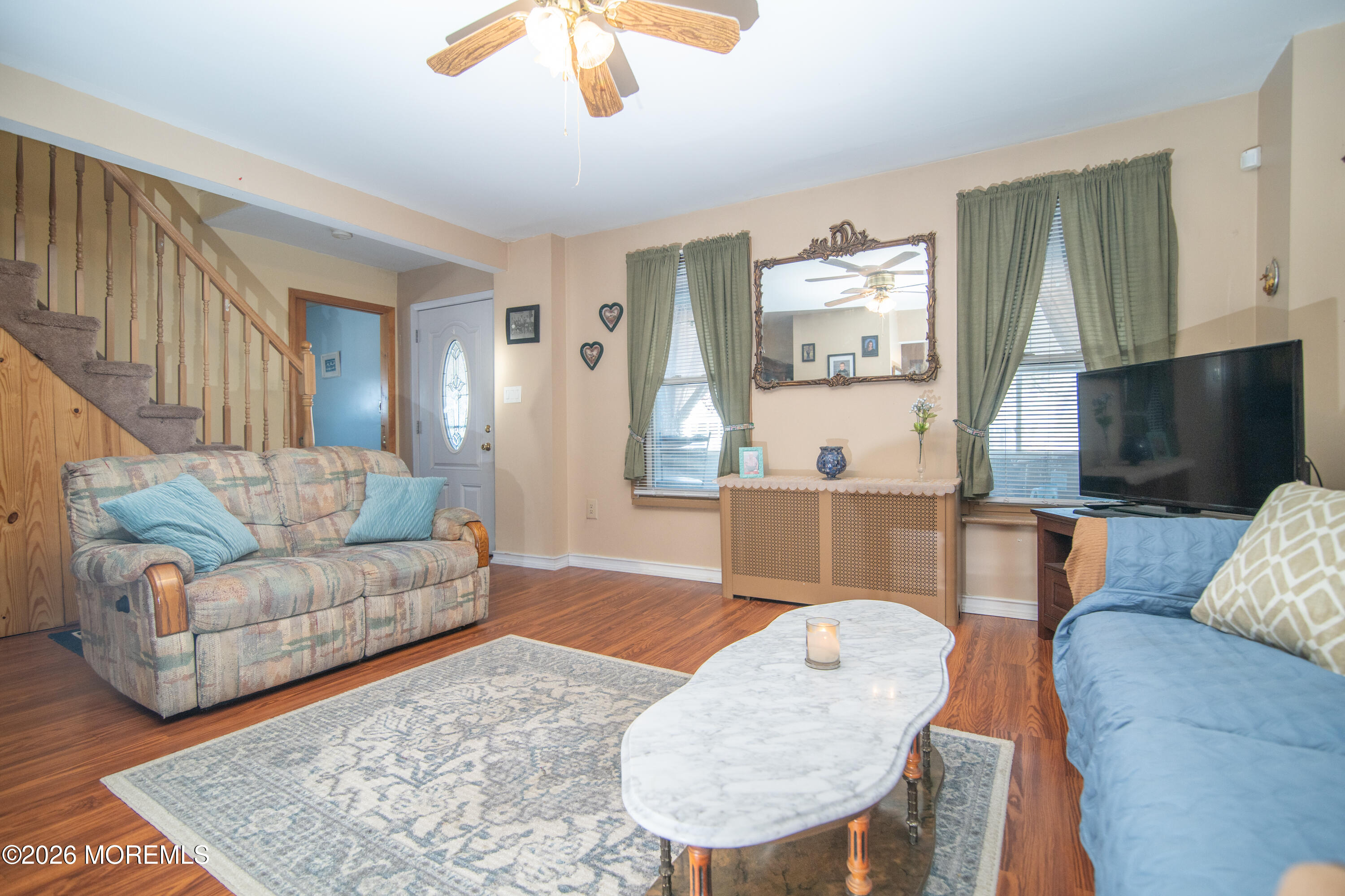 55 Lower Main Street Aberdeen, NJ 07747 - Photo 6 of 28 a living room with furniture and a flat screen tv