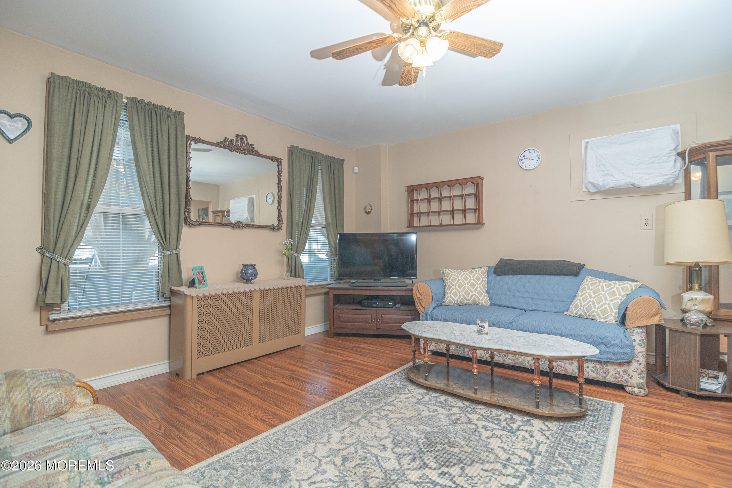 55 Lower Main Street Aberdeen, NJ 07747 - Photo 7 of 28 a living room with furniture and a flat screen tv