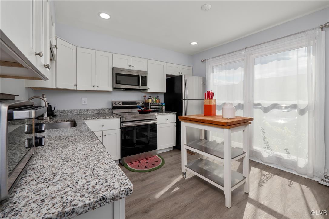 Updated kitchen with SS appliances, granite and ne
