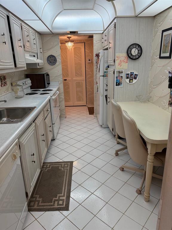 7081 Environ Boulevard, Unit 440 Lauderhill, FL 33319 - Photo 5 of 25 View of Kitchen From Entry Foyer