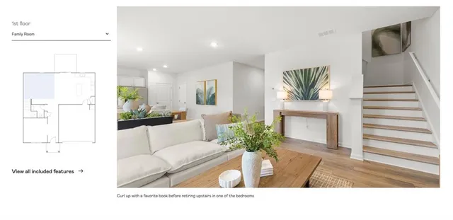 a living room with a large window and a table