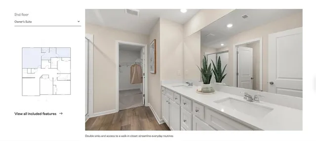 a bathroom with a tub shower and a sink