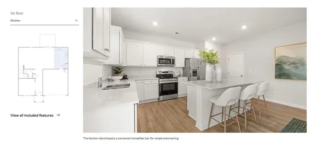 a kitchen with stainless steel appliances white cabinets and a sink