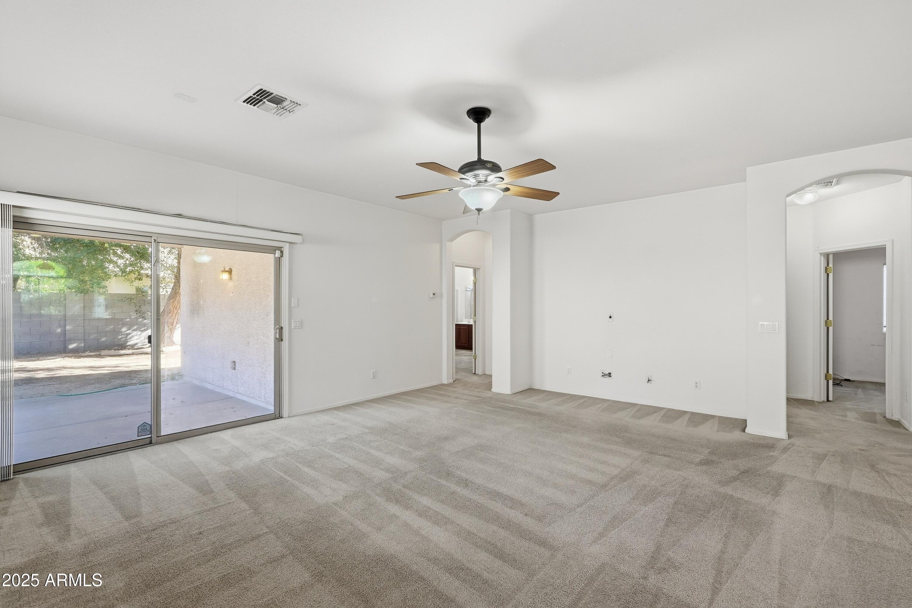 14568 West Crocus Drive Surprise, AZ 85379 - Photo 18 of 36 a view of an empty room with a window