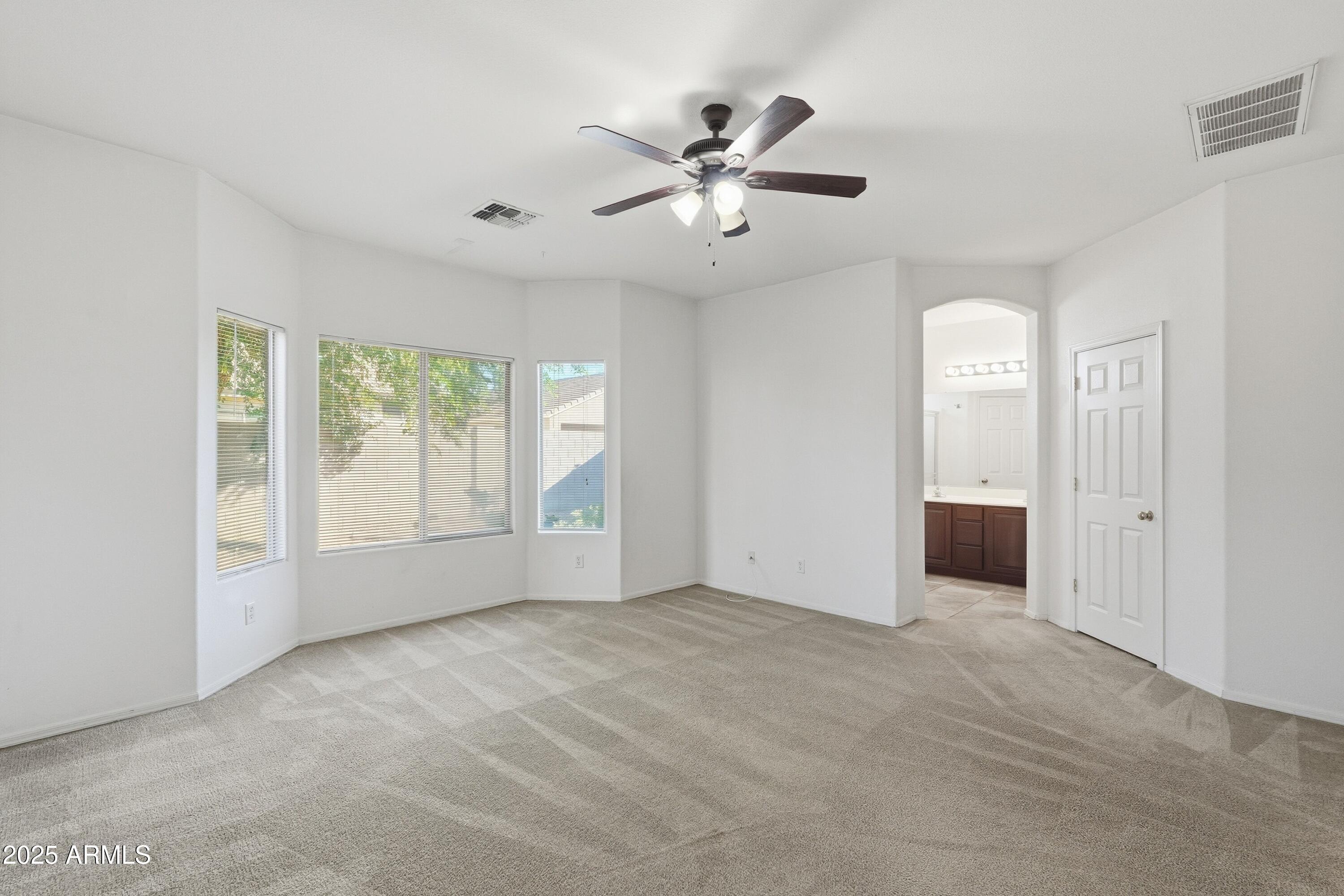 14568 West Crocus Drive Surprise, AZ 85379 - Photo 21 of 36 a view of an empty room with a window