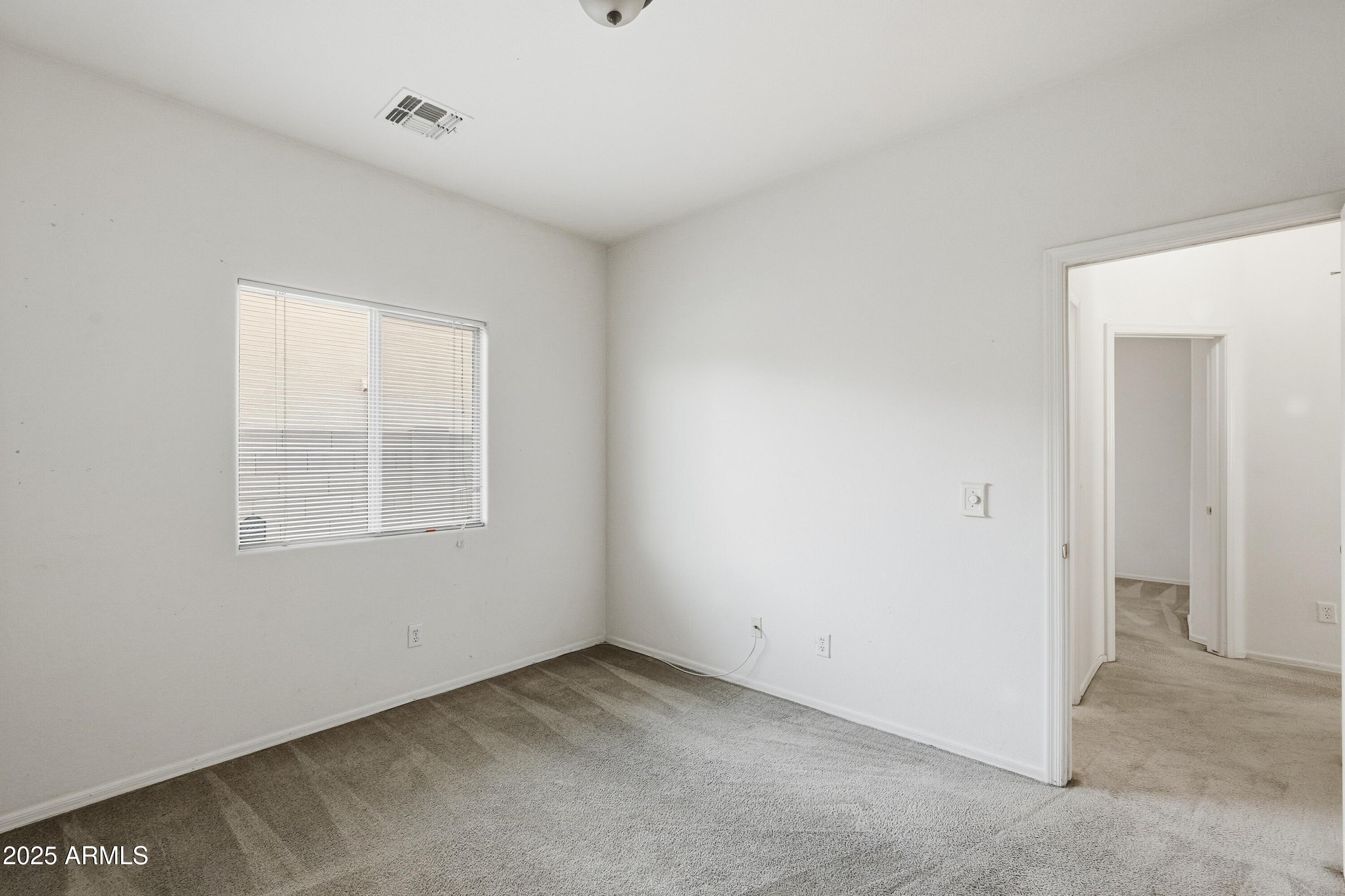 14568 West Crocus Drive Surprise, AZ 85379 - Photo 26 of 36 an empty room with a window
